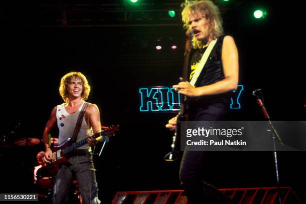American Rock musicians Tommy Shaw and James 'JY' Young, both of the group Styx, plays guitars as they perform onstage during the group's 'Kilroy Was...