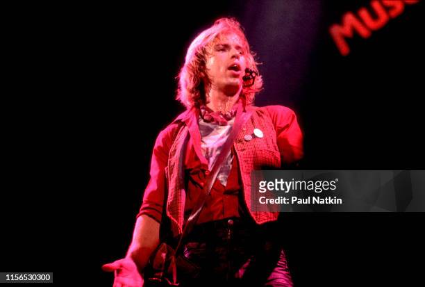 American Rock musician Tommy Shaw, of the group Styx, plays guitar as he performs onstage during the group's the 'Kilroy Was Here Tour' at the...