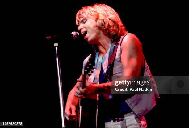 American Rock musician Tommy Shaw, of the group Styx, plays guitar as he performs onstage during the group's the 'Kilroy Was Here Tour' at the...