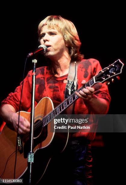 American Rock musician Tommy Shaw, of the group Styx, plays guitar as he performs onstage during the group's the 'Kilroy Was Here Tour' at the...