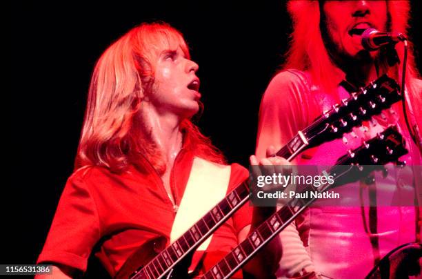 American Rock musicians Tommy Shaw and James 'JY' Young, both of the group Styx, play guitars as they perform onstage at the Auditorium Theater,...