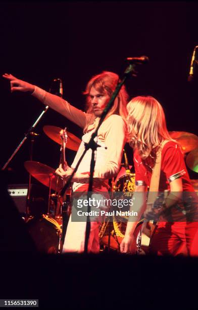 American Rock musicians James 'JY' Young and Tommy Shaw, both of the group Styx, play guitars as they perform onstage at the Auditorium Theater,...