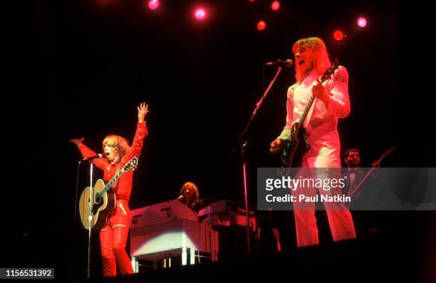 American Rock musicians Tommy Shaw and James 'JY' Young, both of the group Styx, play guitars as they perform onstage at the Auditorium Theater,...