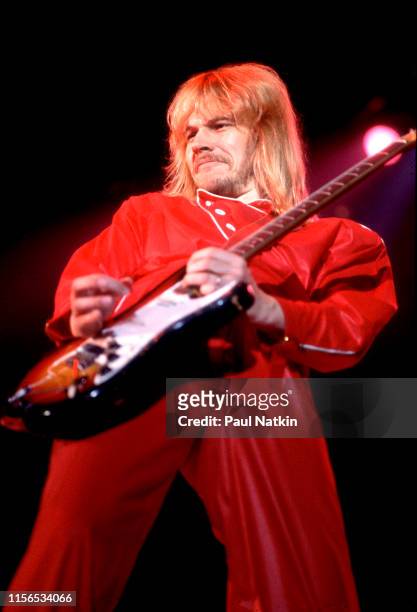 American Rock musician James 'JY' Young, of the group Styx, plays guitar as he performs onstage at the International Amphitheatre, Chicago, Illinois,...