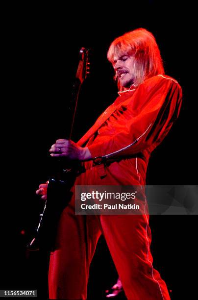 American Rock musician James 'JY' Young, of the group Styx, plays guitar as he performs onstage at the International Amphitheatre, Chicago, Illinois,...