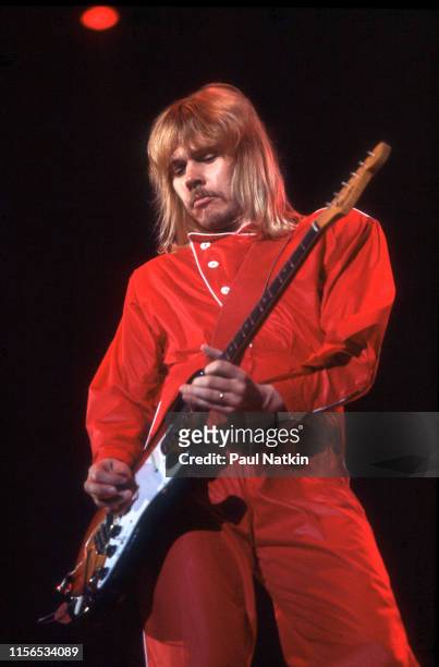 American Rock musician James 'JY' Young, of the group Styx, plays guitar as he performs onstage at the International Amphitheatre, Chicago, Illinois,...