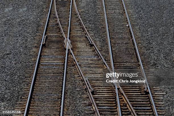 railway junction joining tracks - weichen gleise stock-fotos und bilder