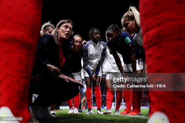 Corinne Diacre, Head Coach of France speaks with her team during a team huddle after the 2019 FIFA Women's World Cup France group A match between...