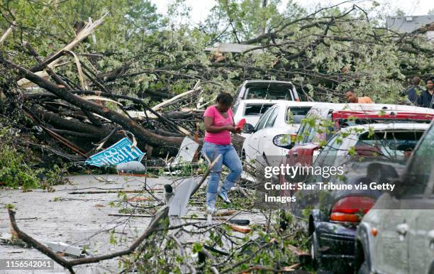Mlevison@startribune.com Tornado and storm damage in the Penn and 25th Ave. Neighborhood of north Minneapolis. IN THIS PHOTO:Residents made their way...