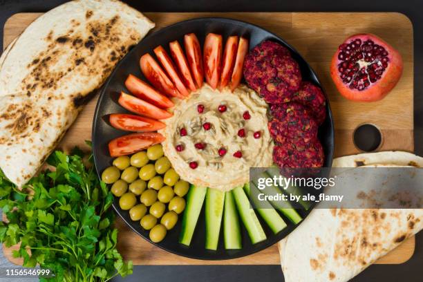 falafel, pita, hummus and vegetables - tahini stock pictures, royalty-free photos & images