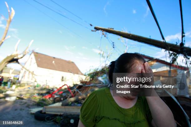 Jerry Holt‚Ä¢ jgholt@startribune.com Tornado and storm damage in the Penn and 25th Ave. Neighborhood of north Minneapolis. IN THIS PHOTO: Chue Vang...