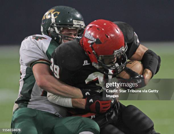 Kittson County Central vs. Wheaton-Herman-Norcross in 9-Man semi-final game at the Dome, 11/19/11. Kittson County Central's Tanner Lyberg pulled down...