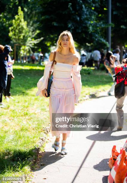 Ada Kokosar is seen wearing pink off shoulder dress outside Fendi during the Milan Men's Fashion Week Spring/Summer 2020 on June 17, 2019 in Milan,...