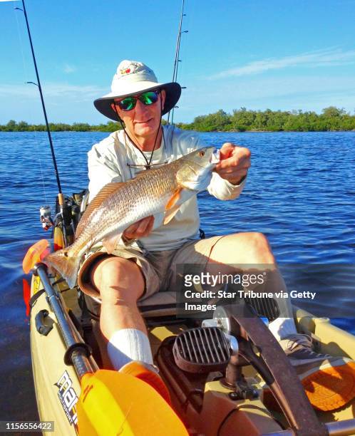 Kernon Bast of Hudson, Wis., with a dandy redfish taken in water about 2 feet deep. The fish hit a Johnson Silver Minnow, a popular lure in northern...