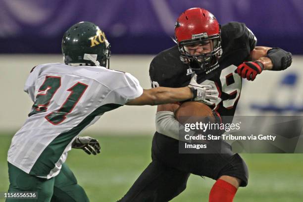 Kittson County Central vs. Wheaton-Herman-Norcross in 9-Man semi-final game at the Dome, 11/19/11. Kittson County Central's Robert Ryden defended as...