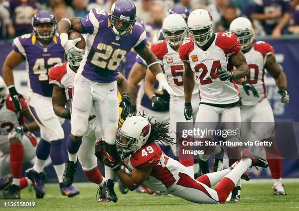 Minnesota Vikings running back Adrian Peterson broke the tackle of Arizona Cardinals strong safety Rashad Johnson in the third quarter during Sunday...