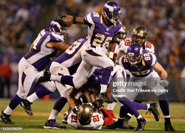 Minnesota Vikings running back Adrian Peterson picked up a three yards in the third quarter during NFL action between Tampa Bay and the Minnesota...