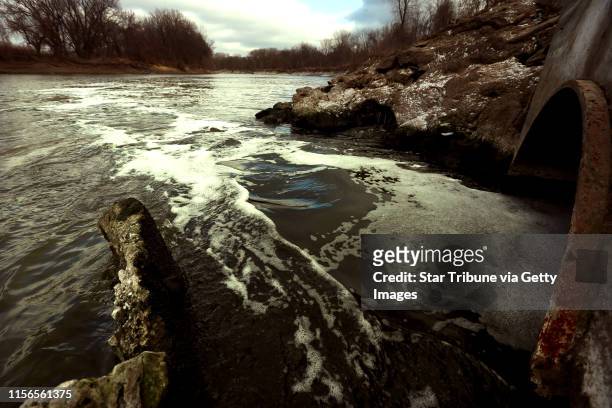 Water flows into the Minnesota River from a pipe connected to the Blue Lake treatment plant in Shakopee, MN, Monday Nov.12,2012. Phosphorus, the...