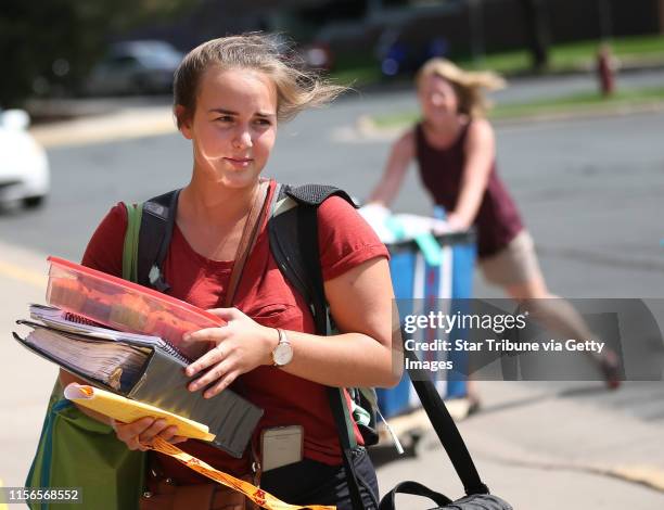 First year student Jessica James of Racine, Wisconsin and her mother Stephanie James carried her bags to the her dorm room Middlebrook Hall at the...