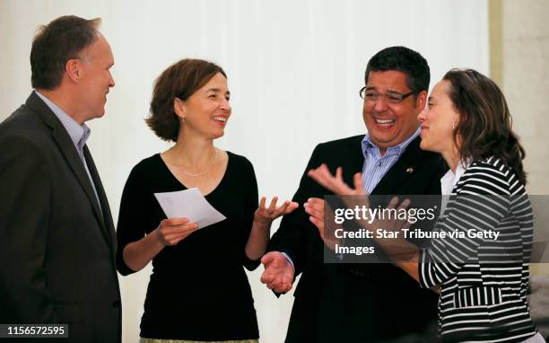 Jeff Isaacson left ,Cathy ten Broeke , Al Giraud and Margaret Miles chatted with each other before they were introduced by Mayor R.T. Rybak at the...