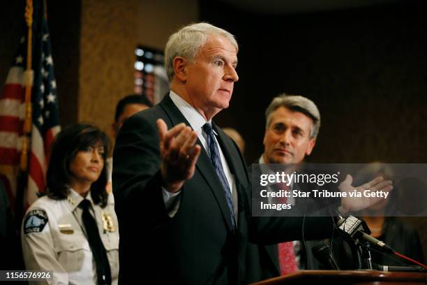 Tom Barrett mayor of Milwaukee spoke during a news conference as ,mayor R.T. Rybak looked on after the morning sessions of a regional gun summit...