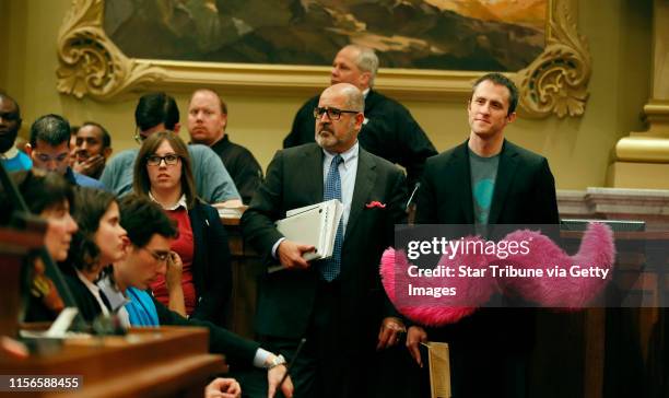 Matthew Johnson right waited his turn to speak at a public hearing at Minneapolis City council chambers on Tuesday. Taxi drivers and supporters of...