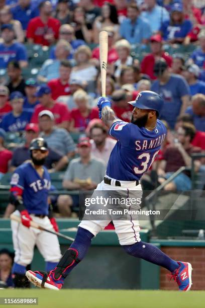 Danny Santana of the Texas Rangers hits a two-run home run against the Cleveland Indians in the bottom of the fourth inning at Globe Life Park in...