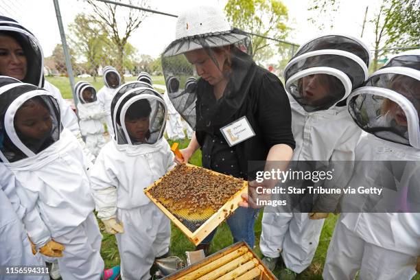 Erin Rupp a bee keeper with Pollinate Minnesota showed third graders at Loring Community School a frame with honey bees Wednesday May 10, 2017 in...