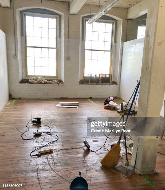 vacant artist studio with cleaning supplies ready for new tenant - lowell massachusetts foto e immagini stock