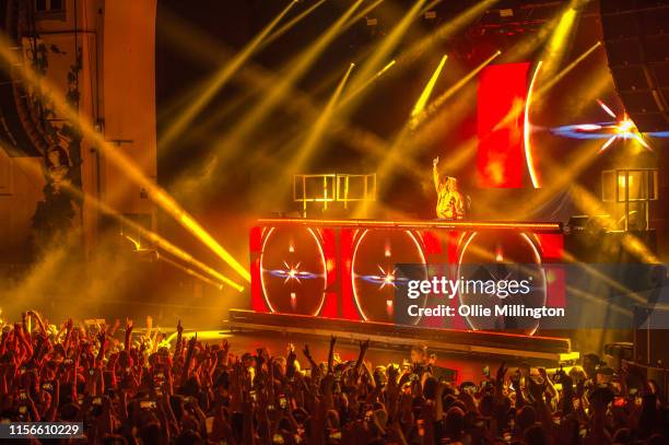 Die Antwoord fans enjoy the atmosphere as DJ Hi-Tek performs onstage at O2 Academy Brixton on June 17, 2019 in London, England.