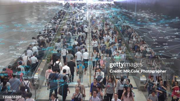 networking connection and communication concept with crowd commuters of pedestrian commuters on train station at hong kong station.internet of things and big data concept - hong kong mass transit fotografías e imágenes de stock