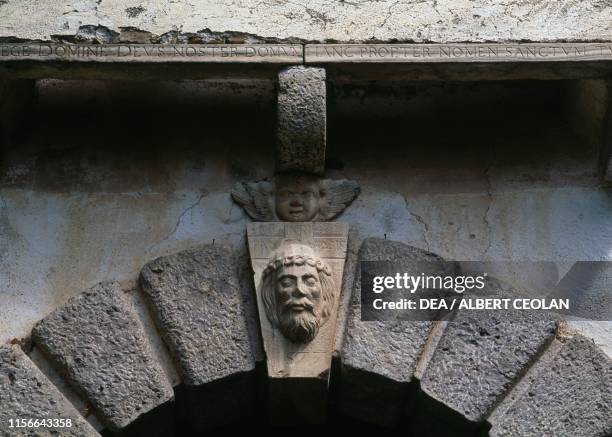 Inscription and relief with the Face of Jesus, second gateway to Hochosterwitz Castle, Carinthia, Austria, 9th-16th century.