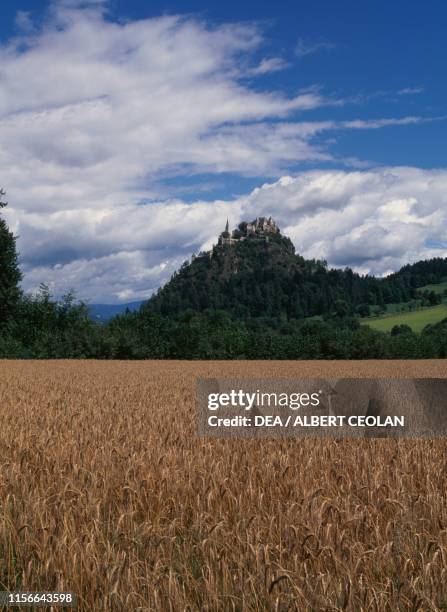 View of the Hochosterwitz Castle, a cornfield in the foreground, Carinthia, Austria, 9th-16th century.