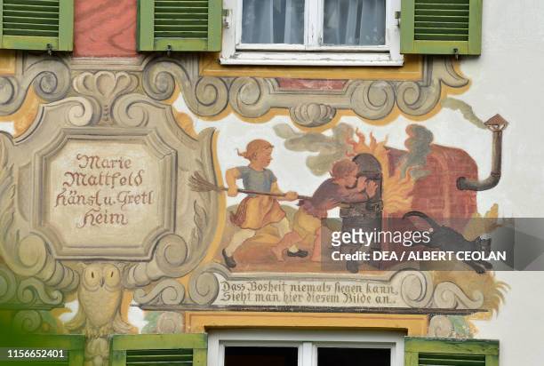 Mural painting on the facade of a house depicting the fairy tale Hansel and Gretel, Oberammergau, Bavaria, Germany.