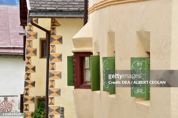Green shutters of a house, Guarda, Scuol, Engadin, Canton of Graubunden, Switzerland.