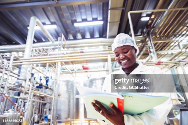 food processing plant engineer at work in africa - food factory stock pictures, royalty-free photos & images