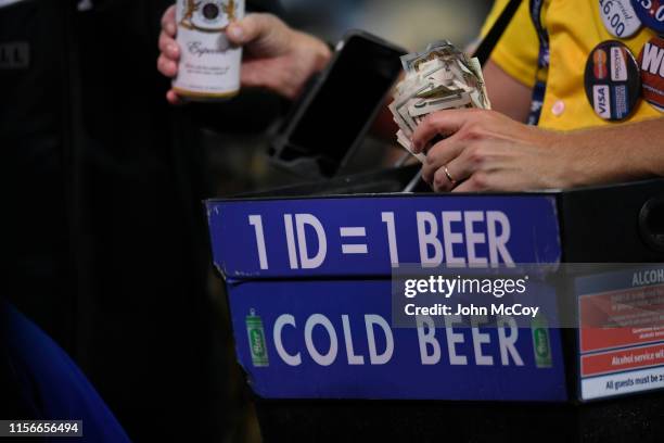 Close up of a beer sales guys hands filled with case while the Los Angeles Dodgers played the San Francisco Giants at Dodger Stadium on June 17, 2019...