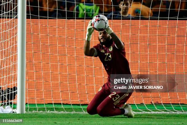 Algeria's goalkeeper Rais M'Bolhi makes a save during the 2019 Africa Cup of Nations Final football match between Senegal and Algeria at the Cairo...