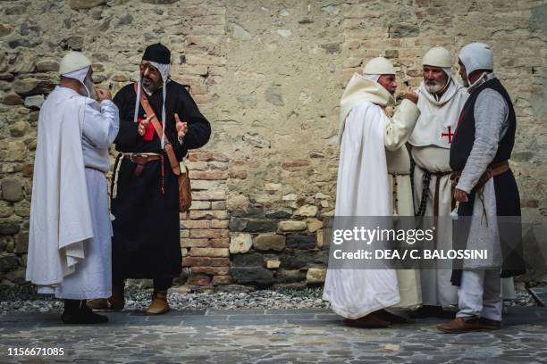 The Grand Master of the Templar Order discussing with the Treasurer , three Knights Templar on the right, Pallavicino Castle, Varano de' Melegari,...