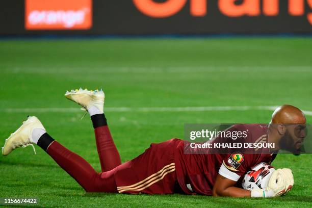Algeria's goalkeeper Rais M'Bolhi gathers the ball during the 2019 Africa Cup of Nations Final football match between Senegal and Algeria at the...