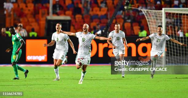 Algeria's defender Mehdi Tahrat, Algeria's midfielder Adlene Guedioura, Algeria's forward Islam Slimani, Algeria's defender Ramy Bensebaini celebrate...