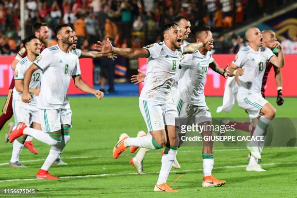 Algerian players celebrate after winning the 2019 Africa Cup of Nations Final football match between Senegal and Algeria at the Cairo International...