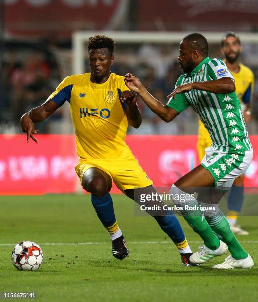 Ze Luis of FC Porto \tries to escape Sidnei of Real Betis Balompie SAD during the match Real Betis v FC Porto - Copa Iberica at Estadio Municipal de...