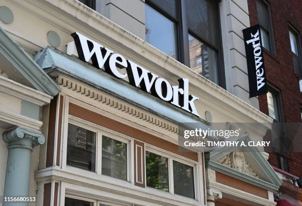 WeWork office is seen in New York City on July 19, 2019. - With its free coffee, couches and glass partitions, shared workspace startup WeWork has...