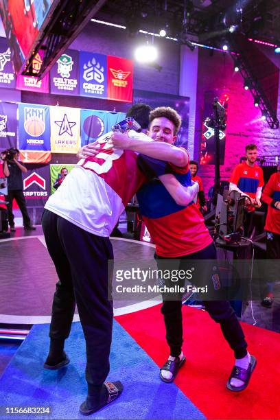 Hood of Heat Check Gaming and DevGoss of the Pistons Gaming Team hug after the game during Week 12 of the NBA 2K League regular season on July 19,...