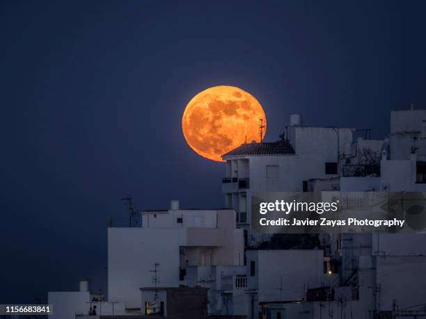 full moon over a town - granada spain stock pictures, royalty-free photos & images