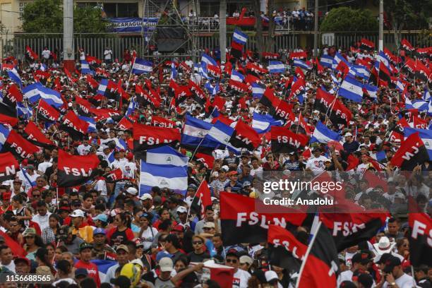 Supporters wave flags at the commemoration of the 40th anniversary of the Sandinista Revolution at "La Fe" square in Managua, Nicaragua on July 19,...