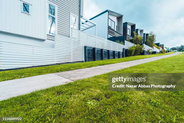 pathway next to houses. - footpath construction stock pictures, royalty-free photos & images