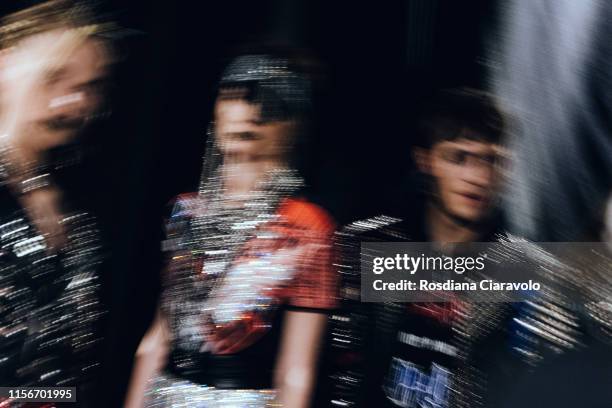 Slow shutter speed picture shows models dress textures at the Philipp Plein backstage during the Milan Men's Fashion Week Spring/Summer 2020 on June...