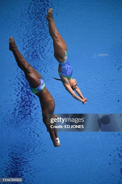 Brazil's Luis Felipe and Brazil's Tammy Takagi compete in the mixed synchronised 3m springboard diving final during the 2019 World Championships at...